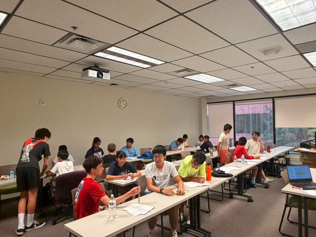 Students collaborating during Impromptu speaking preparation